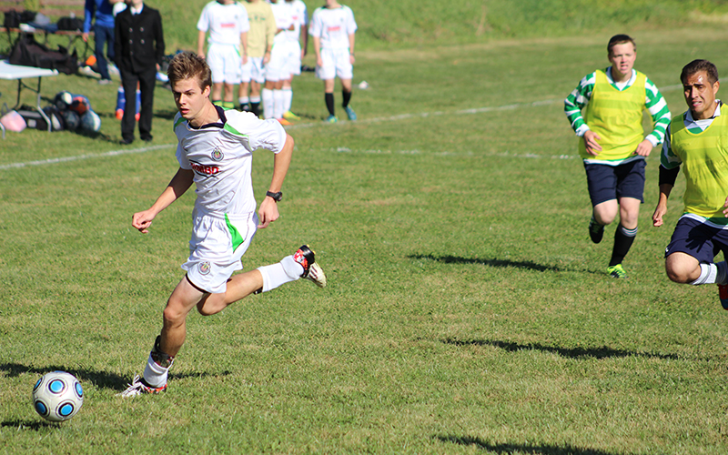 Eric Rudd drives ball down field.